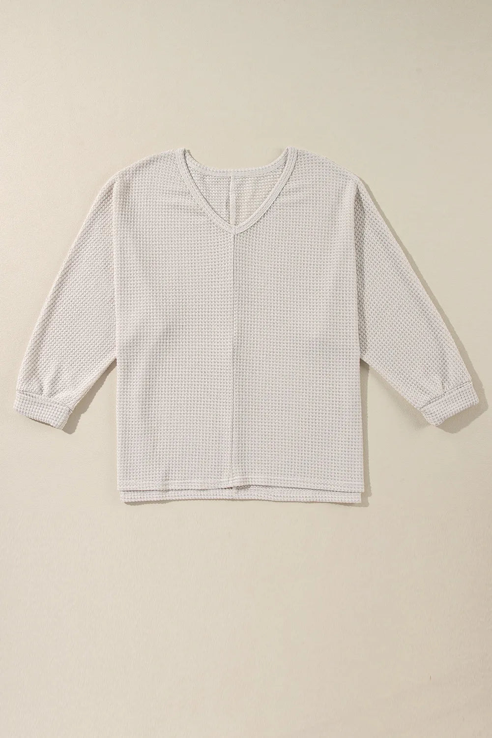 Blusa de manga larga con escote en V y abertura en tejido gofre